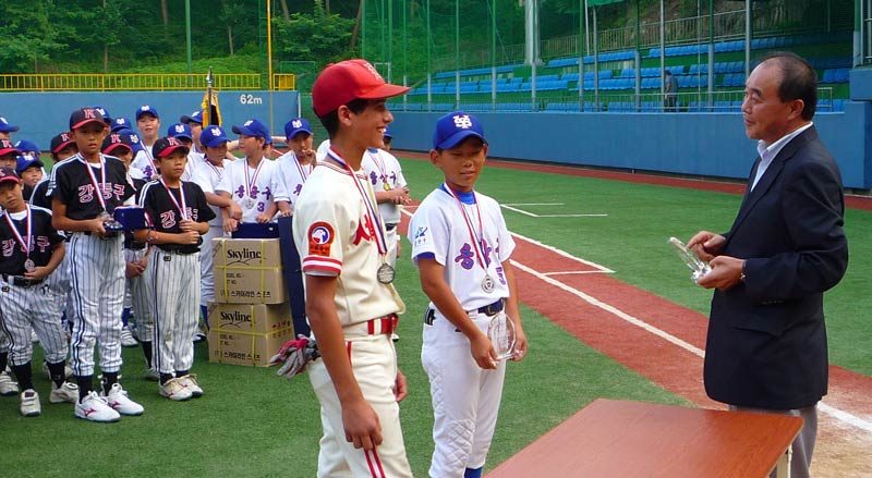 …Austin is being awarded the “Strength of Character Honor”…loosely translated. He deserves it. Not because he is one of two Americans amongst 50+ Korean teams, but because he has shown true strength of character in a difficult and challenging situation. He is beaming and some of the day’s sting subsides for him.
