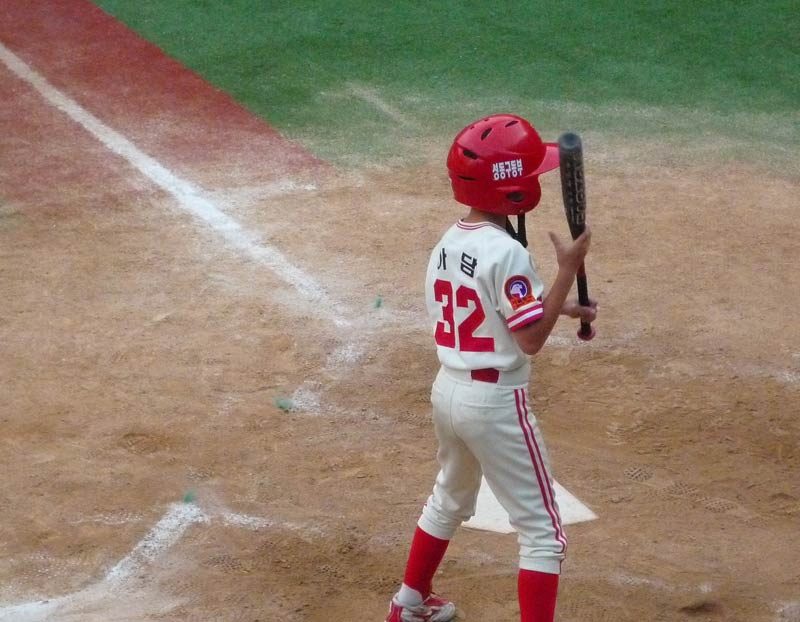 Third Pitch: What’s this? Adam is going to bunt? He is waiving the bat at the pitcher to taunt him…this is unscripted by the Coach, who, is now yelling at Adam… “Ball!!!” The catcher’s mitt cracks…that was close… Fourth pitch: “Ball!” Adam is still alive…