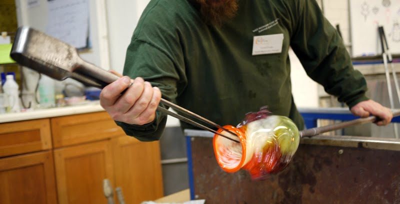 Blowing and shaping takes a lot of skill. So, the master handles the tough part! Can you see the lip of the vase is glowing? That stuff is hot!