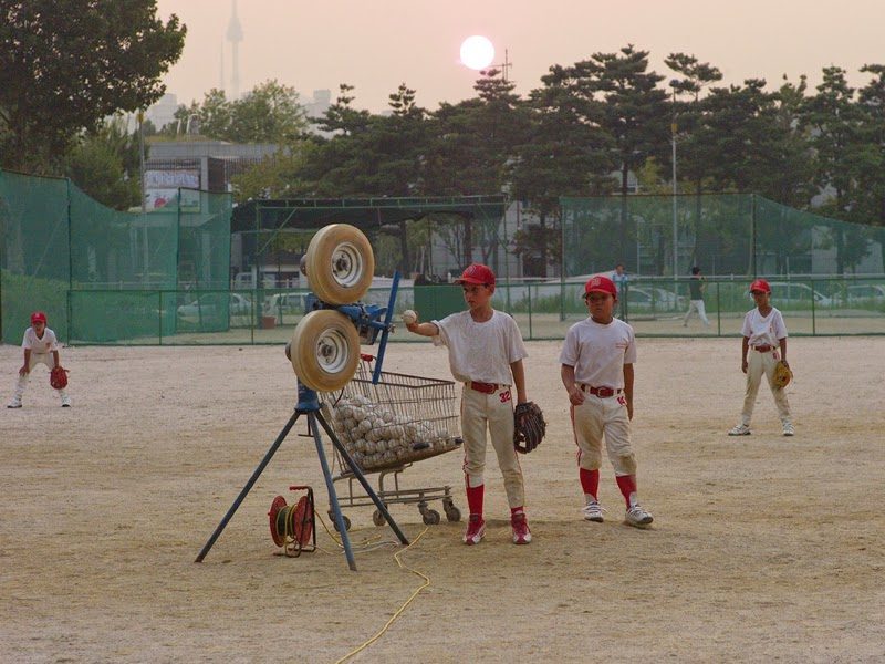 Practicing with the pitching machine.