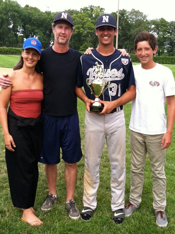 Family photo with a trophy.
