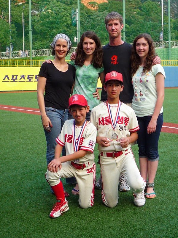 Family photo with trophies.