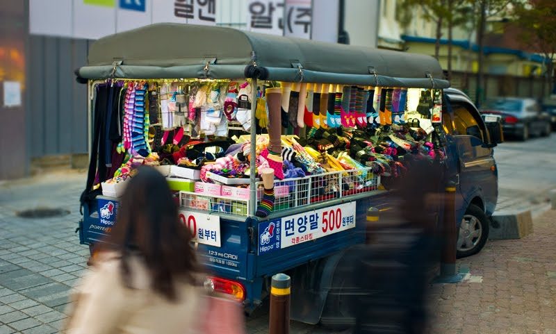 Maybe you need socks? Well they will come to you also…the sign says 500 Won…the equivalent of 40¢ US for a pair. This guy parks next to a new Starbucks…high foot traffic. ;-)