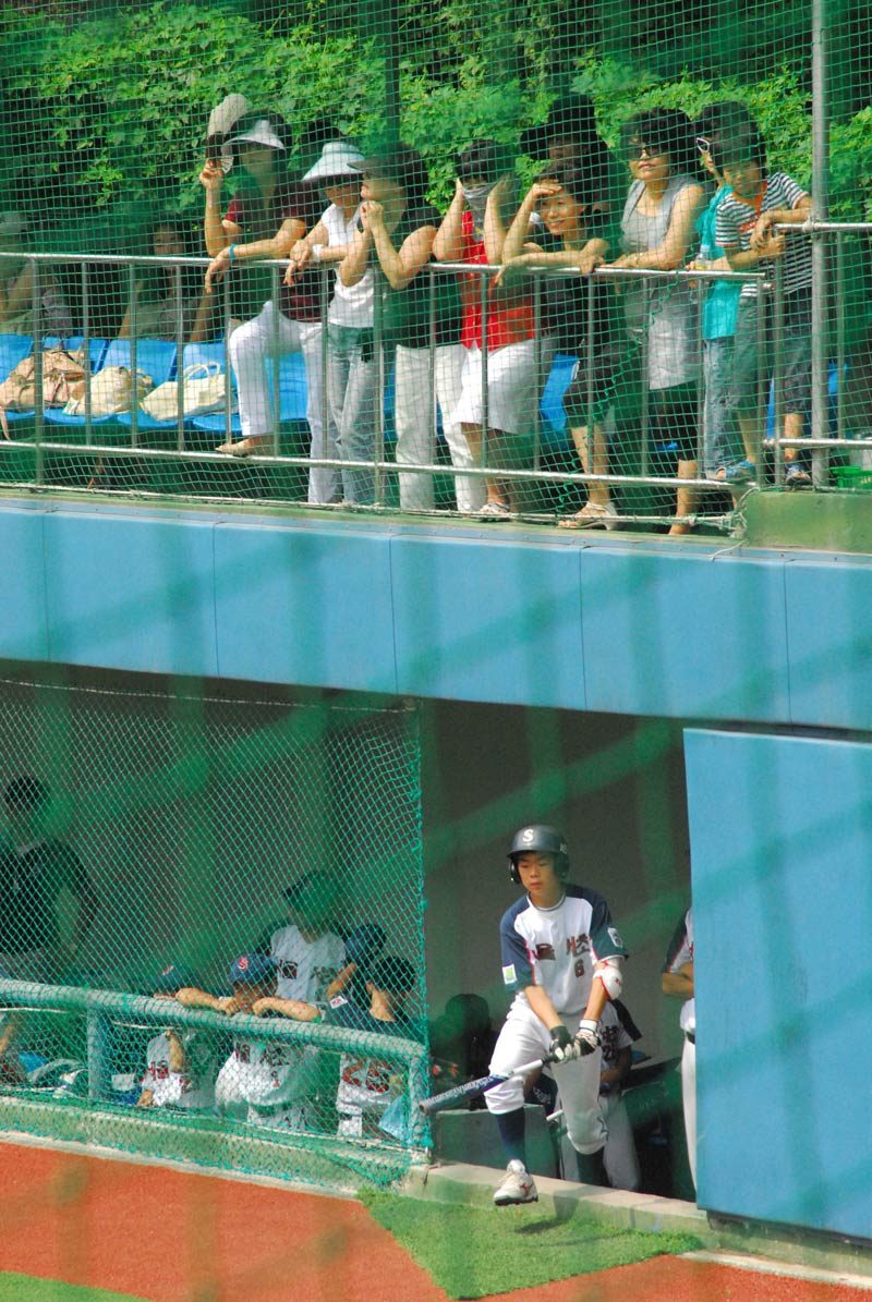 You heard of soccer moms? Well, above, watching every move on the field, are baseball ajuma (moms). I have grown to love them, but don’t make them mad… ;-)