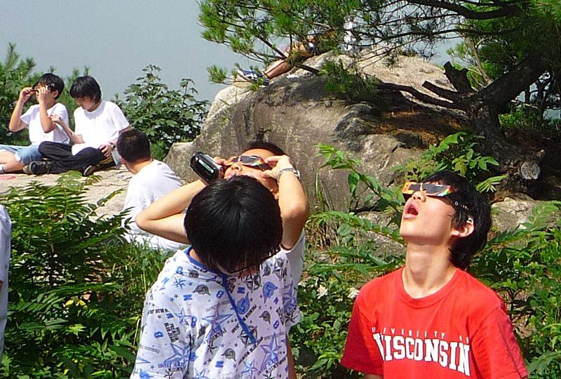 So, when we got up to the top of the mountain we encountered a group of middle school children and their teachers. They had brought special sun glasses so that they could view the eclipse…
