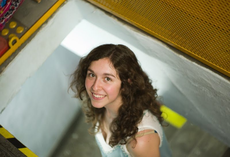 Amanda walking up the narrow stairway complete with a MotoElastico trap door…