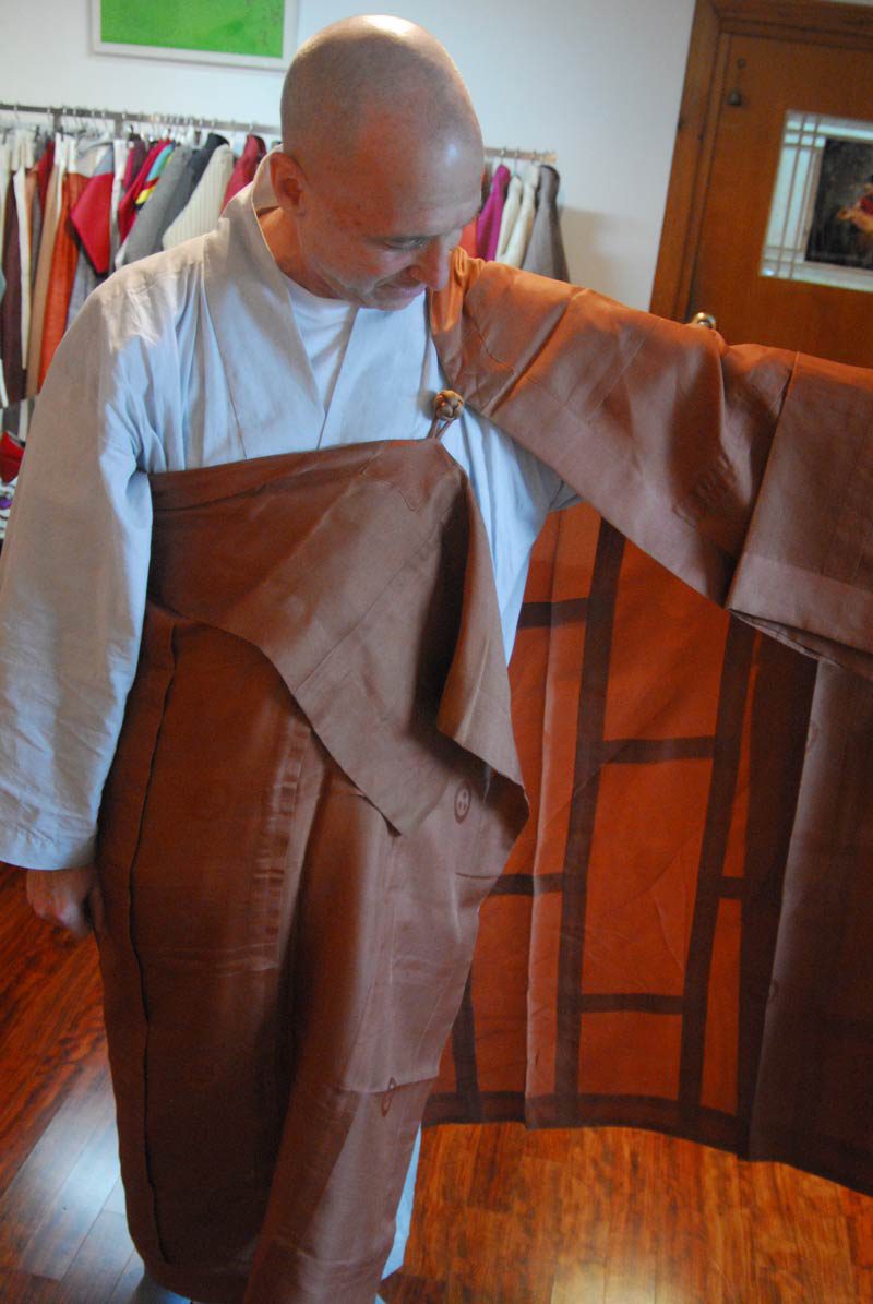 A monk’s seniority is denoted by the number of rectangles in his robe. That’s 25 years worth of robes.